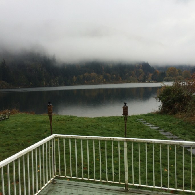 Handyman Rob Brown repairs wooden decks and metal fences at houses in Vancouver, BC. He carefully measures, cuts and installs wood for patios and fences.