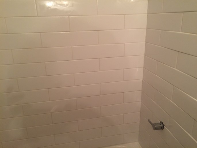 Handyman Rob Brown delivers handyman services for bathroom renovation in Vancouver, BC. He carefully measures, cuts and installs tiles for bathrooms.